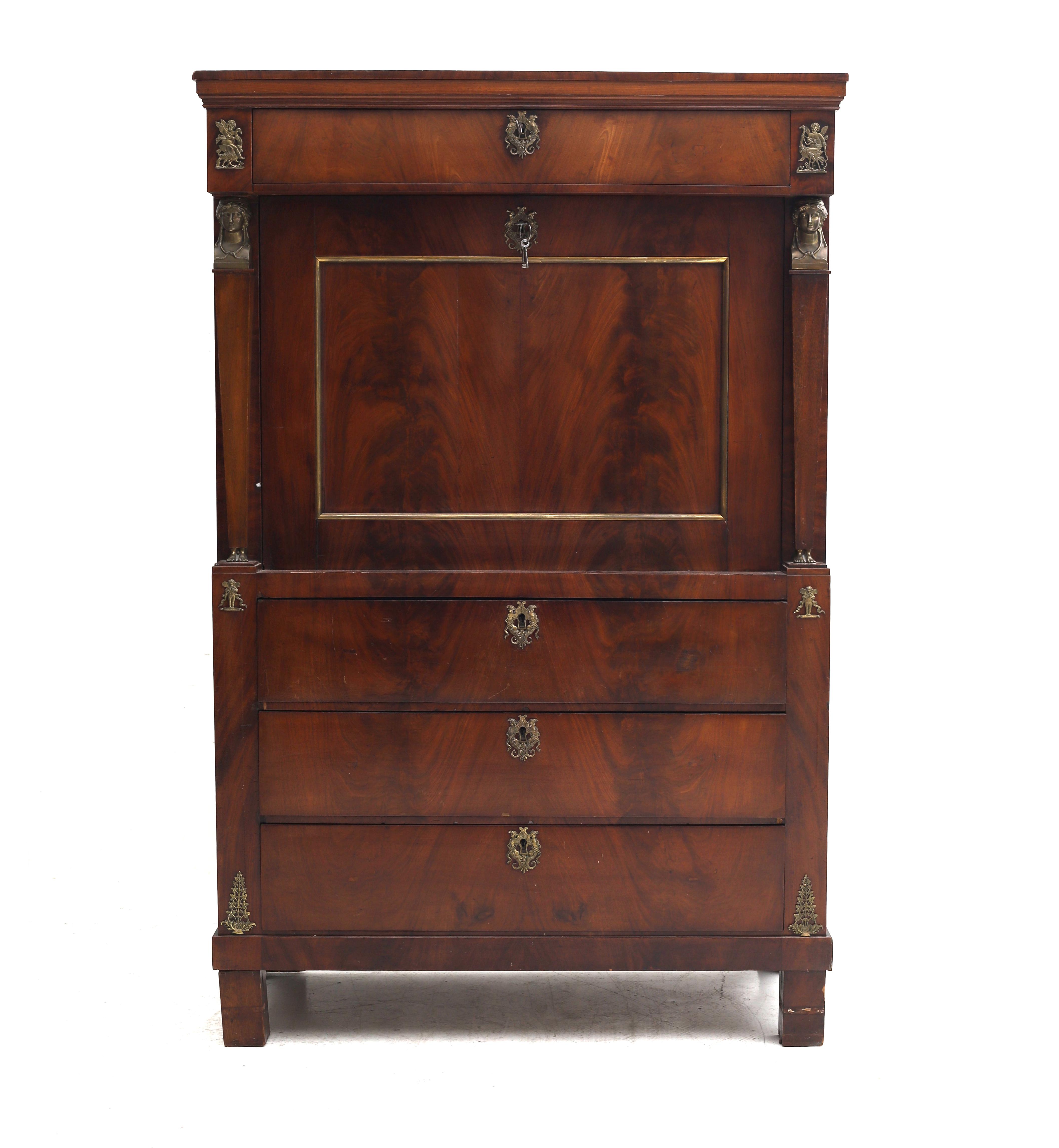 Mahogany veneered, with a wide drawer above a hinged top, behind which various compartments,