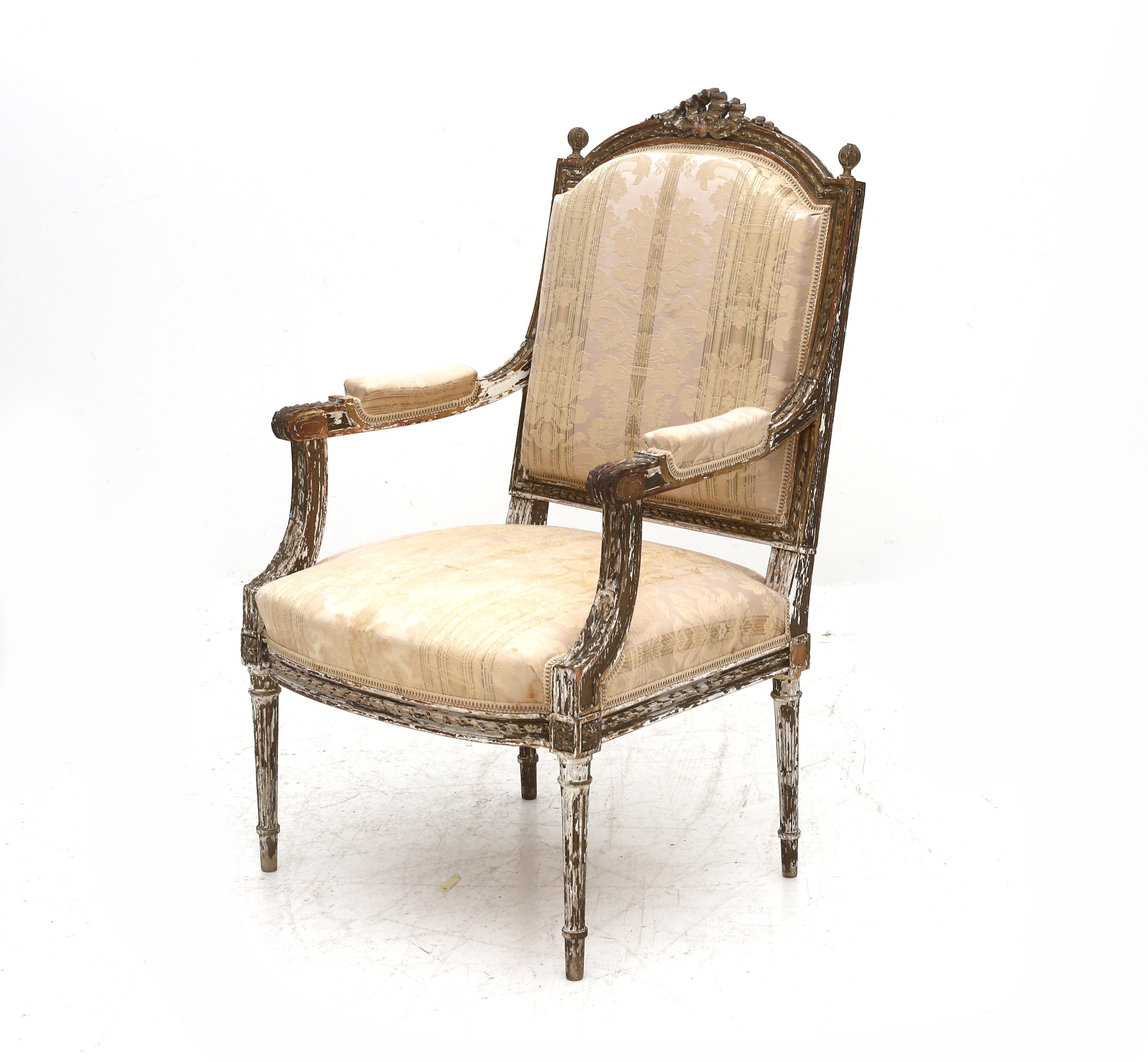 A Bergère in the Louis XVI style from France from the 19th century. Backrest topped with carved