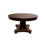 The round top extendable and on a four sided column, the overall resting on a fourpartite base. In