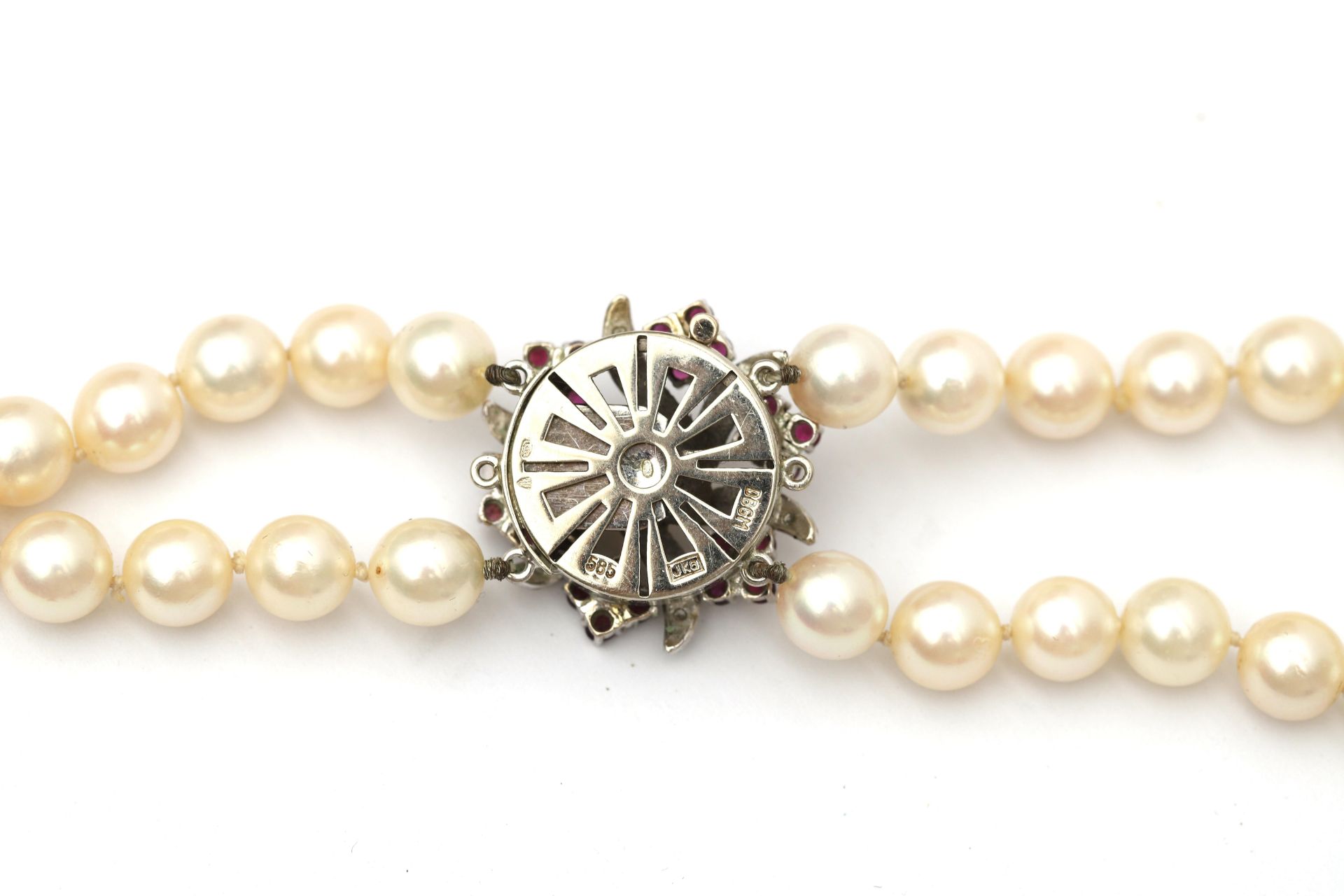 A cultured pearl necklace to a ruby and diamond white gold clasp. Featuring two knotted strands of - Image 2 of 4