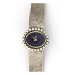 An 18 krt. white gold wristwatch by Baume & Mercier with lapis lazuli and diamond. Ref. no. 400155