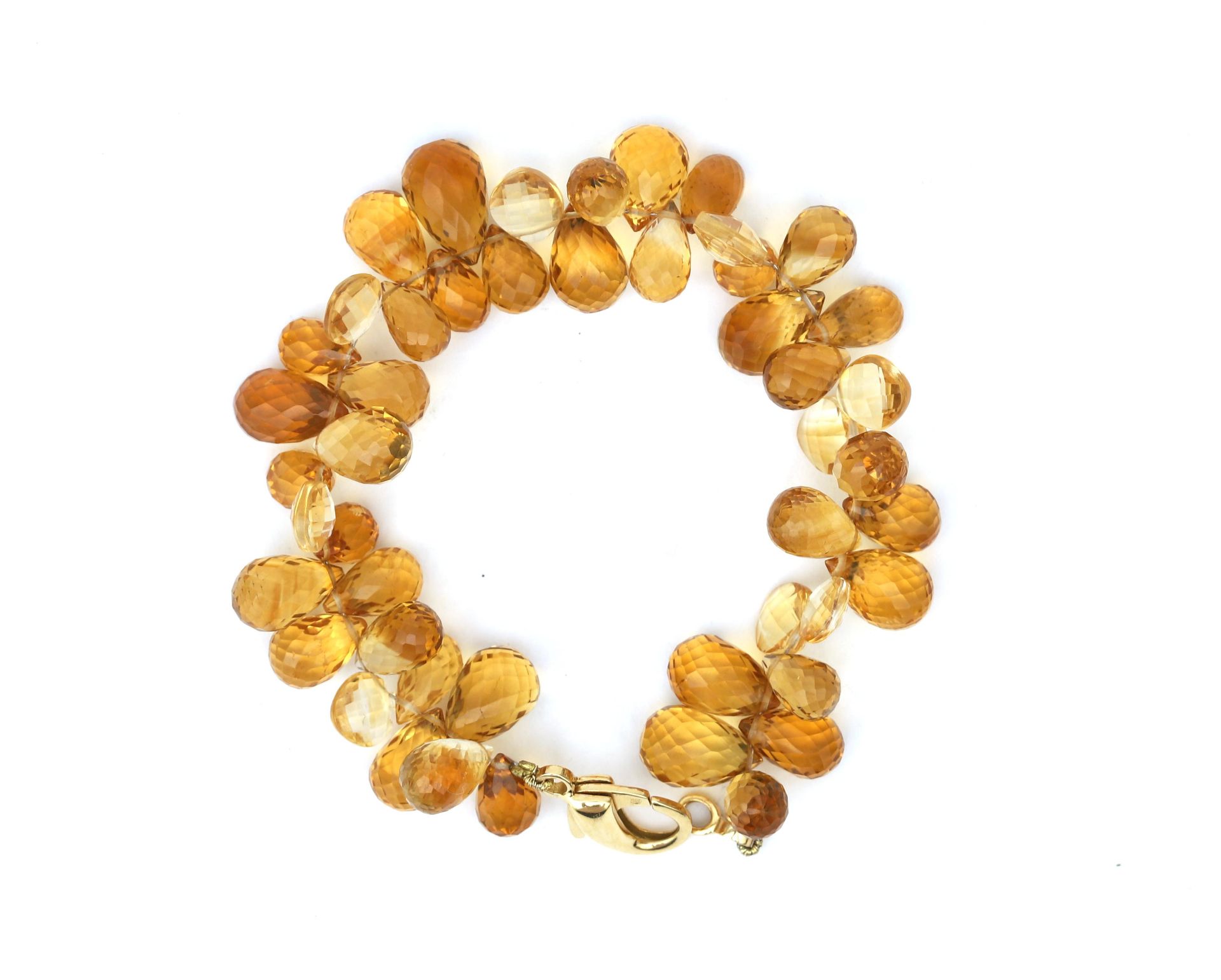 A briolette cut beaded citrine bracelet. To an 18 karat gold lobster clasp. Gross weight: 28 g. L: