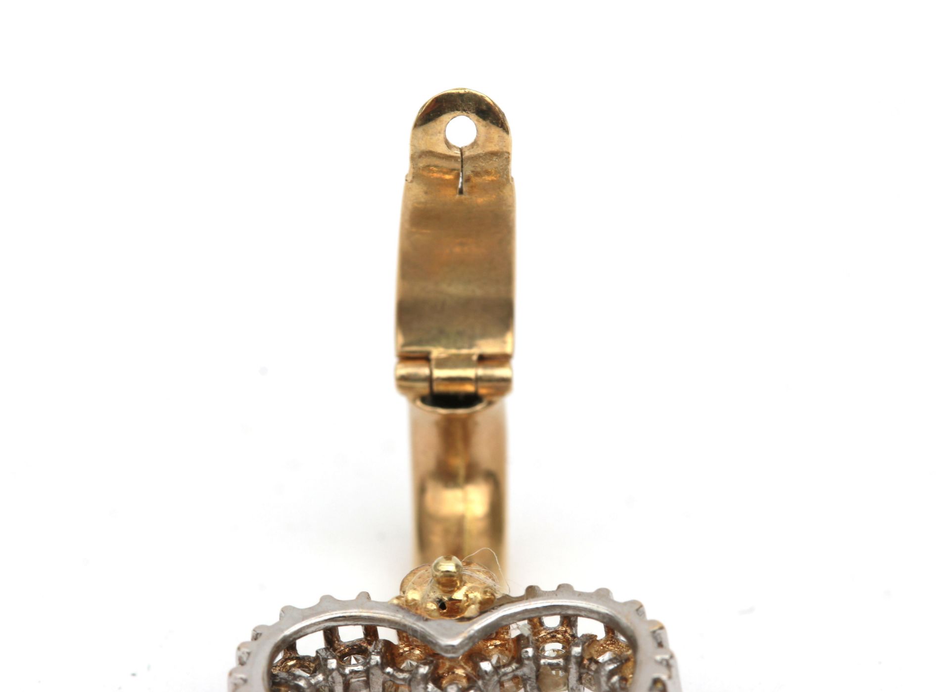 A 14 karat gold diamond set heart shaped pendant. Featuring twenty brilliant cut diamonds, ca. 1. - Image 3 of 3