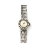 An 18 karat white gold diamond Gerard Perregaux lady's wristwatch. Handwind, 17 jewels. Featuring