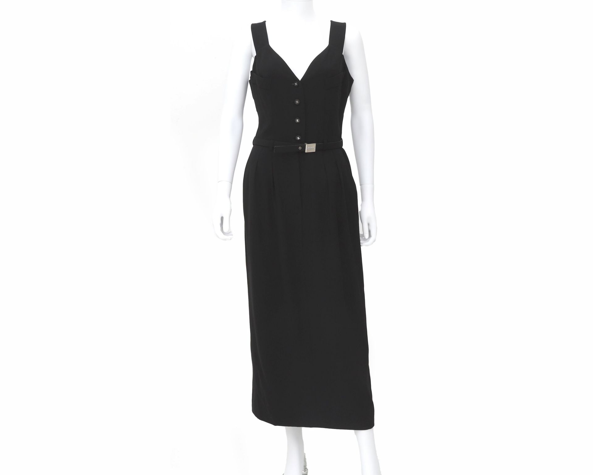 A Chanel Boutique black dress with belt. The belt has a silver-colored buckle with Chanel on it.