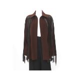 A Hermès coat 100% cashmere in brown colour and leather fringes circa 1990. The coat has a spread
