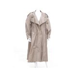 A camel Chanel Boutique trench coat. Comes with a matching belt and has gold coloured 'Coco'