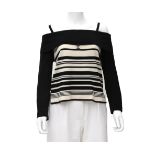 A Chanel Boutique off-shoulder white with black stripe pattern. The CC logo is embroidered in on the