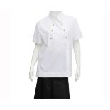 A white Chanel shirt with gold tone buttons. The shirt has short sleeves, an easy fit and decorative