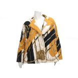 A silk Hèrmes jacket. A quilted all over print in ocher, cream and black. Incl. Hermès dust bag.