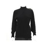 A black wool Chanel turtleneck sweater. With buttons on the neck and shoulder. The buttons are