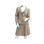 A Beige linen Chanel Boutique ensemble of a blazer and skirt. incl. fabric sample & buttons. The