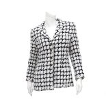 A Chanel Boutique black and white checked blazer. with two outside pockets, and black and gold