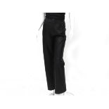 Chanel Boutique black leather pants. The pants have black with gold-colored CC logo buttons at the