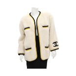 A Chanel Boutique Faux fur coat incl. cover (large fit). A velor CC logo processed on the sleeve