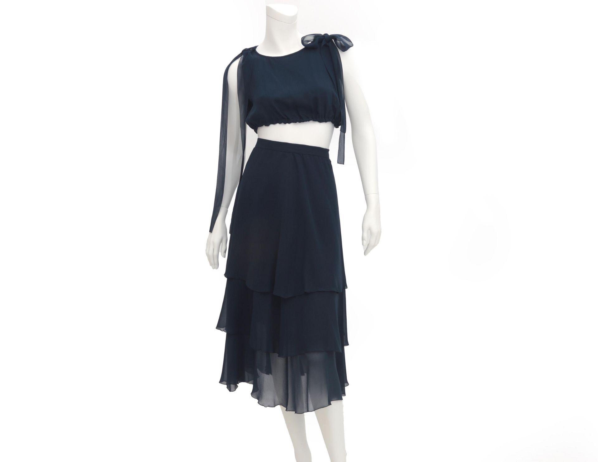 A navy blue Boutique ensemble. Composed of a short top that cab be worn with two bows at the