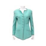 A mint coloured Chanel Boutique jacket. External chest pockets and two side pockets and mint colored