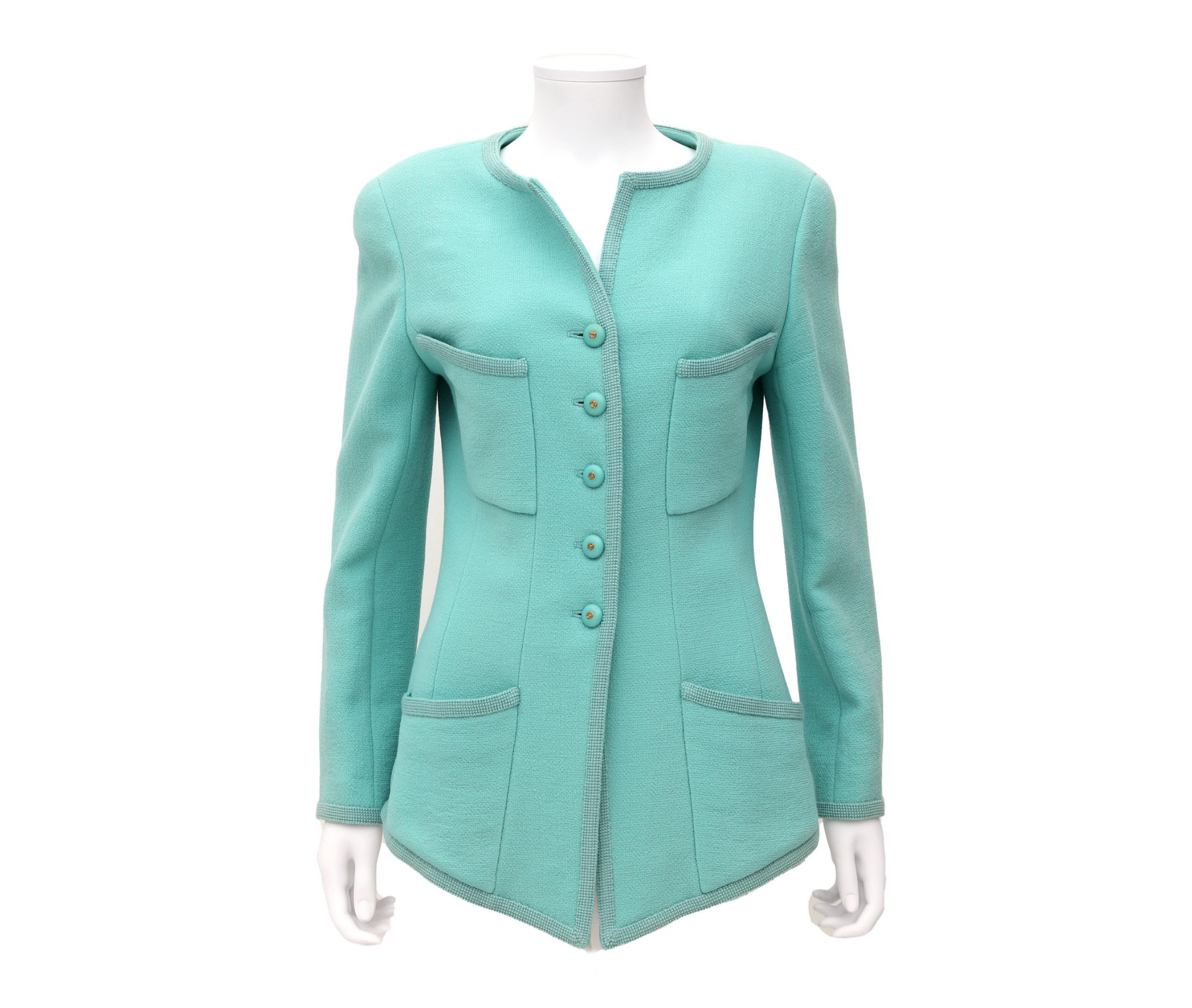 A mint coloured Chanel Boutique jacket. External chest pockets and two side pockets and mint colored
