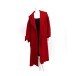 A red wool Chanel Boutique coat. A larger size model with a deep neckline incl. original clothing
