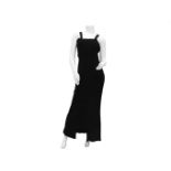 A Chanel Boutique long black dress with crossed shoulder straps. With black and gold CC logo buttons