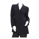 A black wool Hermès blazer. Three pockets at the front and five black 'H' buttons. Incl. Hermès coat