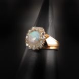 A Ladies 18KG Opal and Diamond Ring