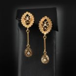 A Pair of 18KG Diamond Earrings