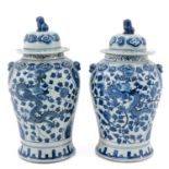 A Pair of Blue and White Jars with Covers