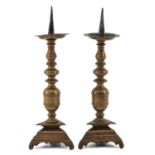 A Pair of 17th Century Bronze Candleticks