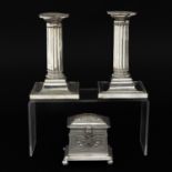 A Silver Savings Pot and Pair of Candlesticks