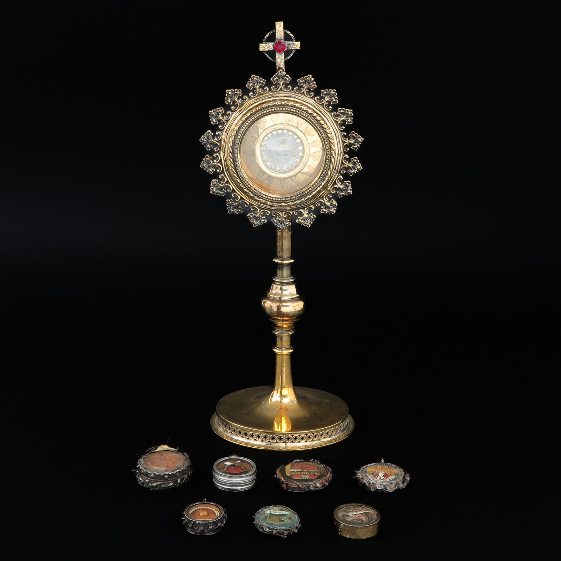 A Collection of Seven Relics and Altar Relic Holder