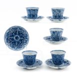 A Collection of Blue and White Cups and Saucers