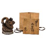 A Japanese Clay Sculpture with Box