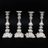 A Set of 4 Silver Candlesticks