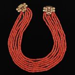 A 19th Century 7 Strand Red Coral Necklace on Gold Clasp