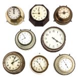 A Collection of 8 Electric Wall Clocks