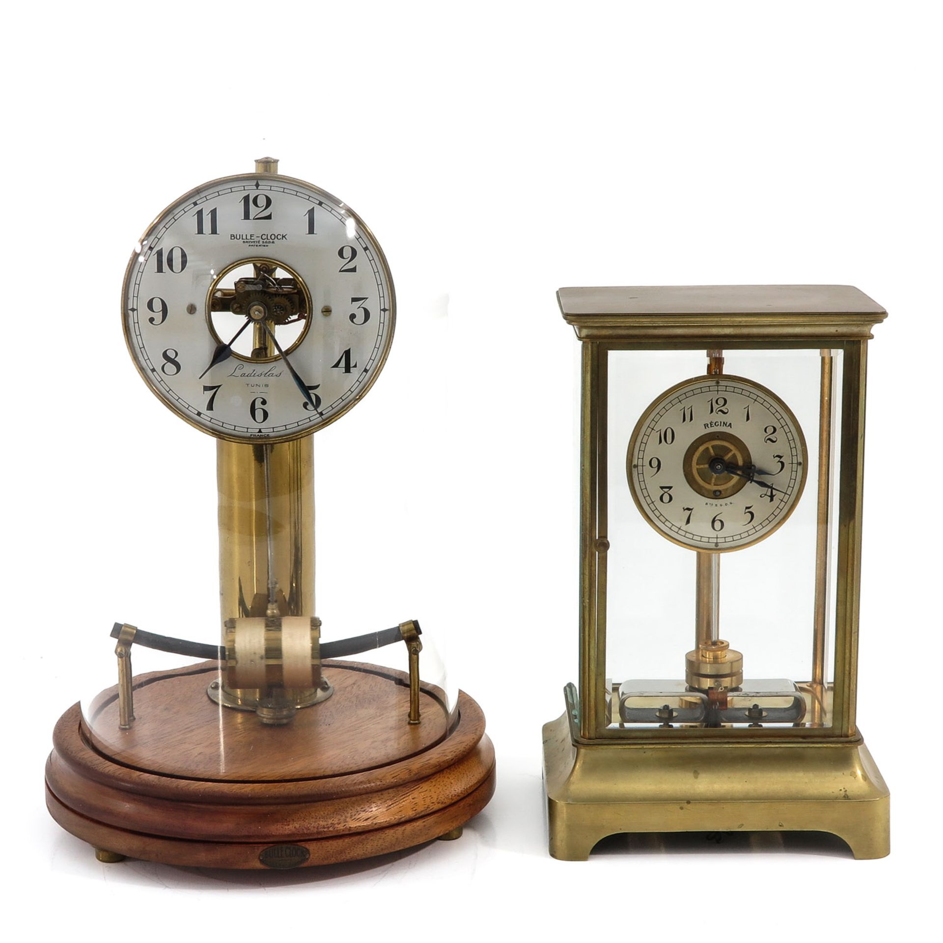 A Lot of 2 Electric Clocks Under Glass