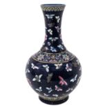 A Blue Ground Buttefly Design Bottle Vase