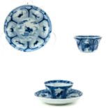 A Pair of Blue and White Cups and Saucers
