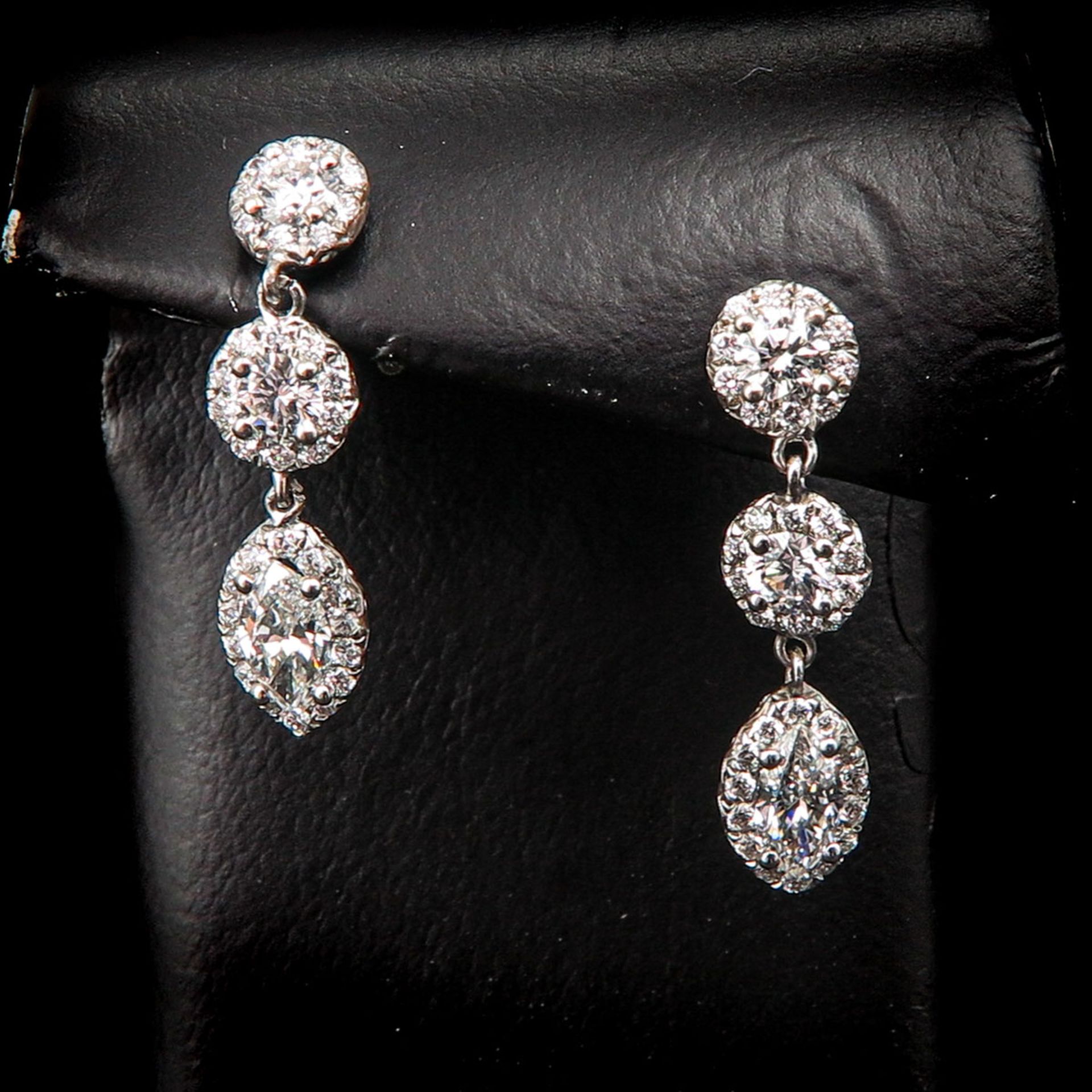 A Pair of 18KG Diamond Earrings.