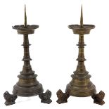 A Pair of Bronze Neo Gothic Pen Candlesticks