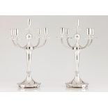 A pair of five branch candelabra