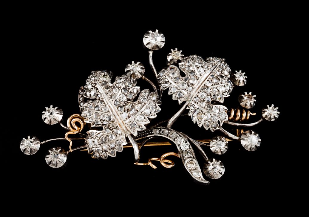 A broochGold and silver Vines set with rose cut and antique brilliant cut diamonds Dog's Head