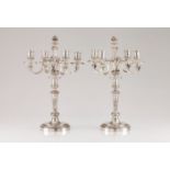 A pair of Christofle four branch candelabraSilvered metal Louis XIV style engraved and reliefs