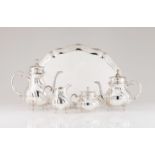 A tea and coffee set with trayGerman silver Plain body and cover of spiralled grooves Volute handle,