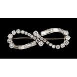 A broochPlatinum Shaped as infinite symbol set with 24 brilliant cut diamonds totalling (ca. 2.40ct)