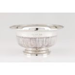 A footed bowlPortuguese silver Part fluted body of grooved lip on a beaded circular foot Eagle
