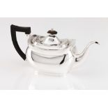 A teapotEnglish silverplate Plain body, grooved frieze to top Dark wooden handle and lid