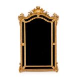 A Louis XV style wall mirrorCarved and gilt wood and gesso Beaded and foliage reliefs decoration