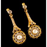 A pair of earringsGold Stylised flower pendant set with one central pearl and various colourless